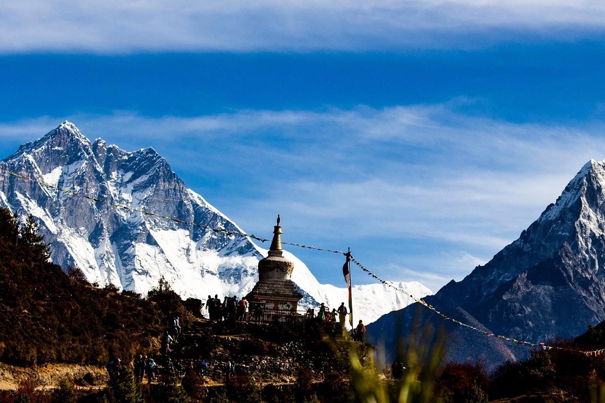 Majestic view of Mount Everest under clear skies during an eco-luxury trek in the Himalayas.